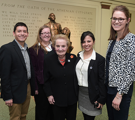 Madeleine Albright posing for a picture with some students