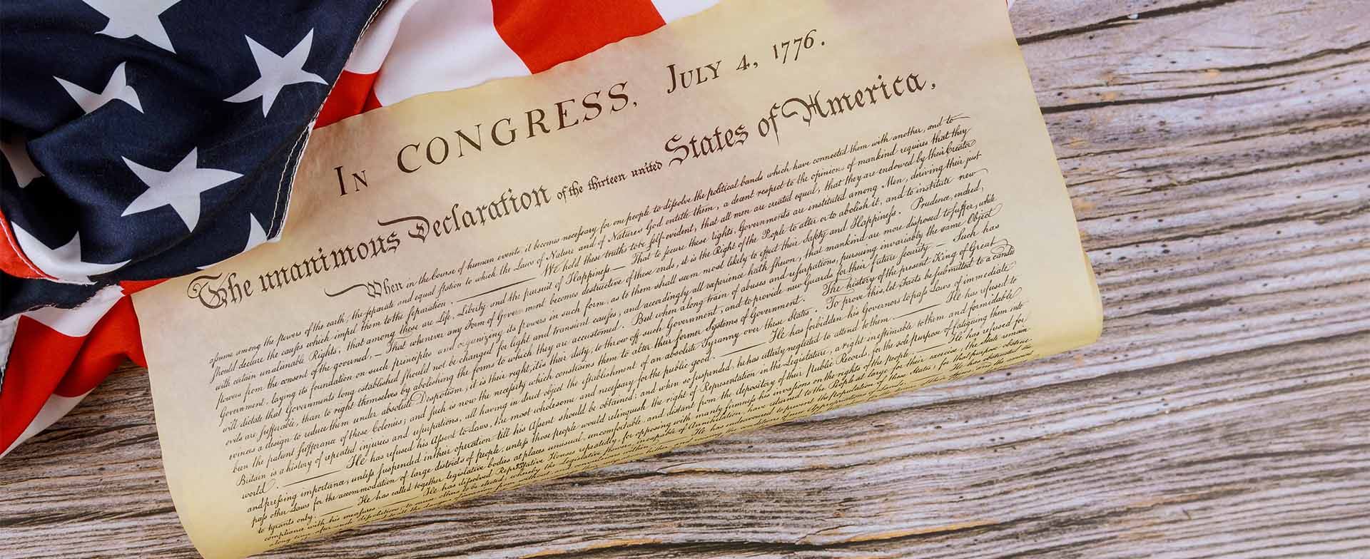 Photo showing a portion of the US flag and the US Declaration of Independence