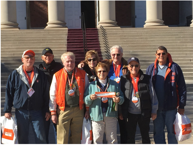 Syracuse University alumni post after walking the SU campus Monday Mile route