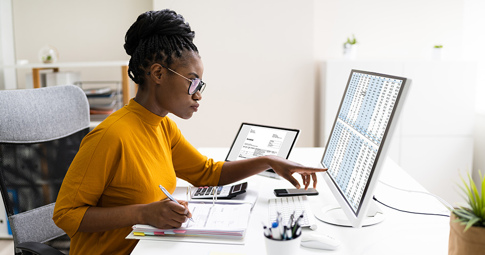Woman at Desk with Spreadsheet