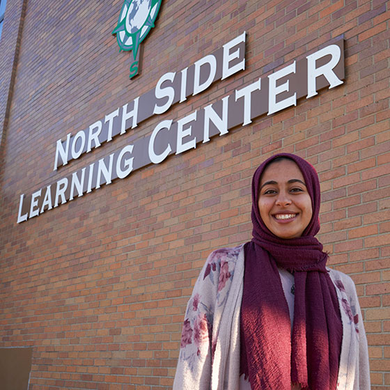 Student in front of North Side Learning Center