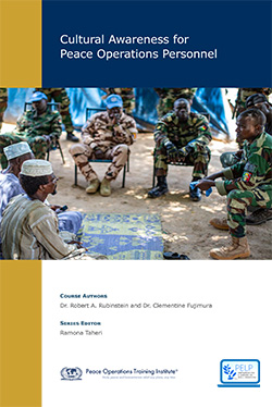 Cover of a booklet titled 'Cultural Awareness for Peace Operations Personnel' showing a group of military personnel in uniform sitting and listening to a speaker in an outdoor setting.