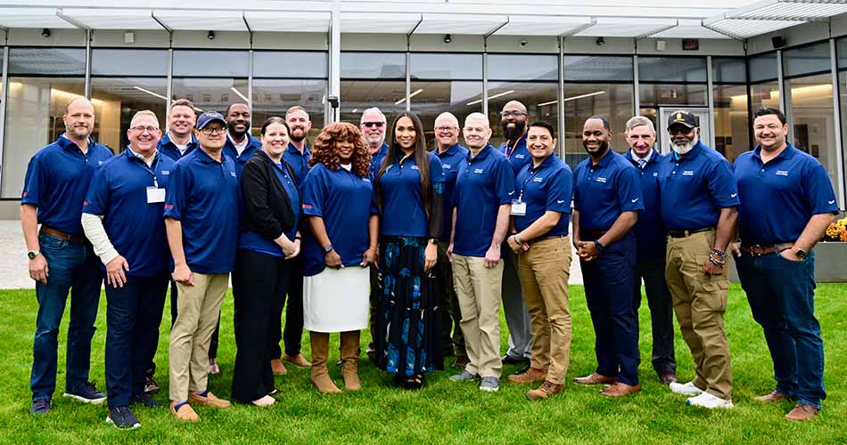 group photo of 2025 cohort for veterans for public office standing outside the IVMF building in syracuse ny