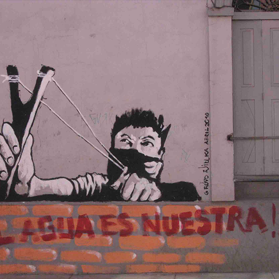 Graffiti of a masked person with slingshot