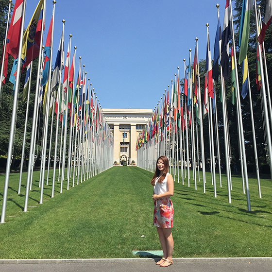 Student overseas with UN flags
