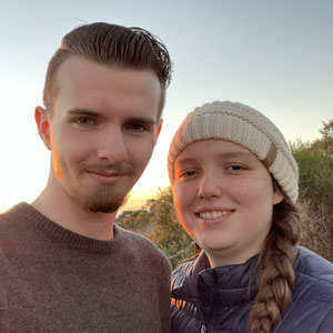 A portrait of Andrew and Kiersten posed together.