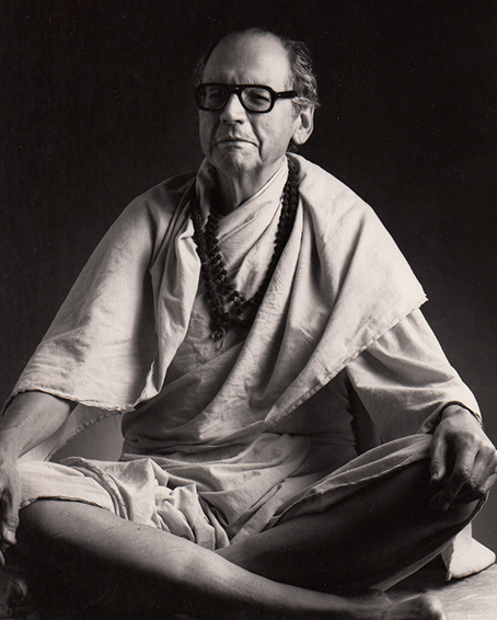 Agehananda Bharati wearing a monk's robes and sitting crosslegged