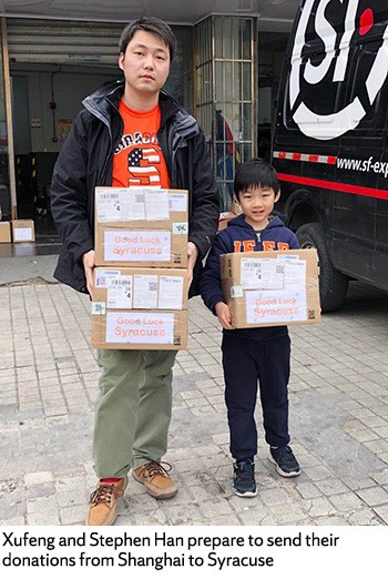 Xufeng and Stephen Han prepare to send their donations from Shanghai to Syracuse.