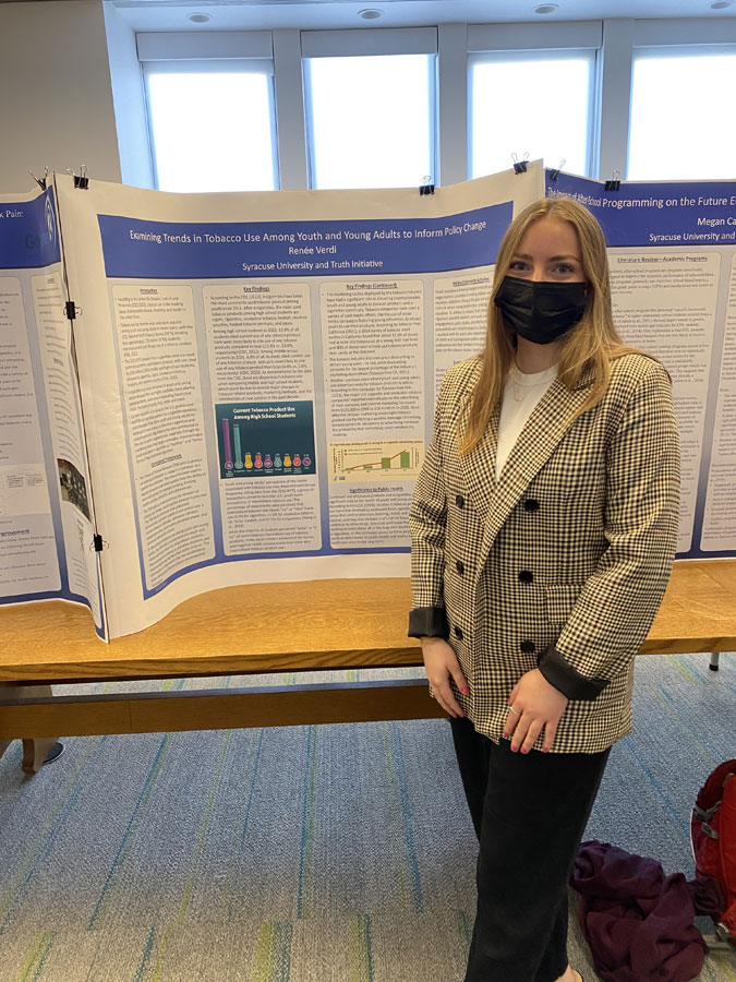Renée Verdi with research poster