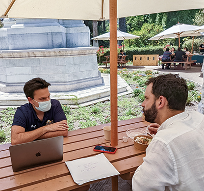 Student Rohan Popenoe sits at a picnic table with Ricardo Montero Allende during his trip to Chile