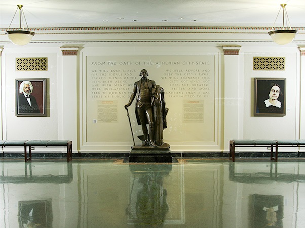George Washington Statue with portraits of Susan B Anthony and Frederick Douglas
