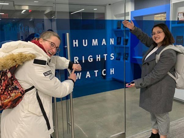 Students standing in front of Human Rights Watch door